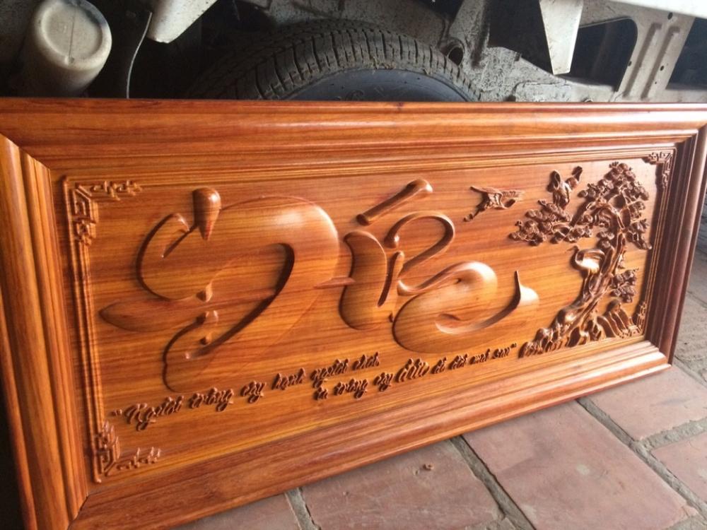 Tranh gỗ khắc chữ “đức” thể hiện được phẩm chất của người Việt